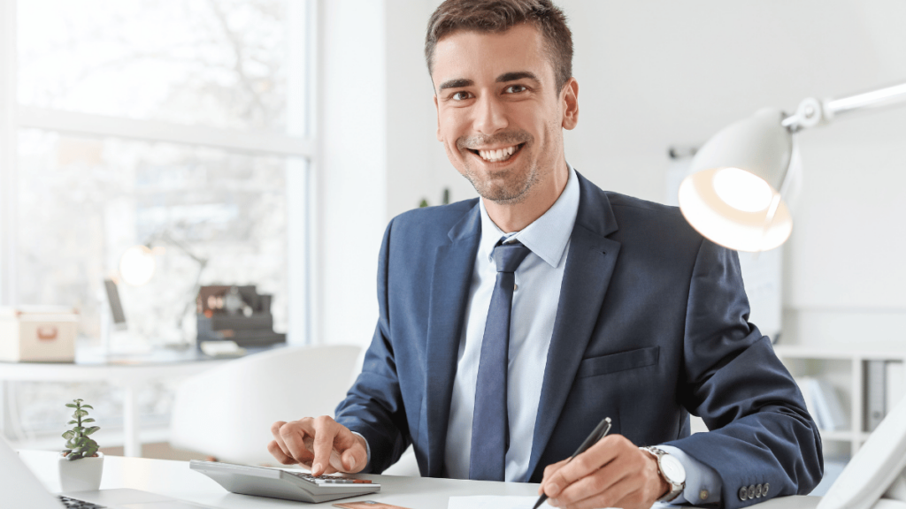 Person signing documents with “Trustee” written next to their name, symbolizing estate planning and communication responsibilities.